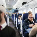 Business people travelling in train